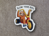 Funny image of sloth riding motorcycle with text slow your roll