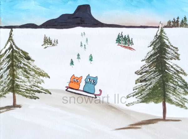 Colorful image of two cats sledding on snow at Thumb Butte in Prescott Arizona